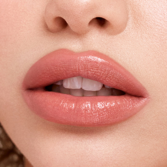Light skin tone model wearing Weightless Lip Color in High Cut