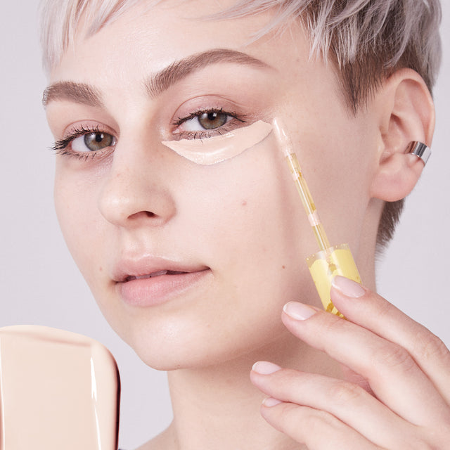 Model wearing Mini Revealer Concealer in Tone 1.5