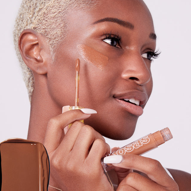 Model wearing Mini Revealer Concealer in Tone 8.7