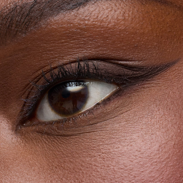 Dark brown eye model wearing Soulgazer in Allure