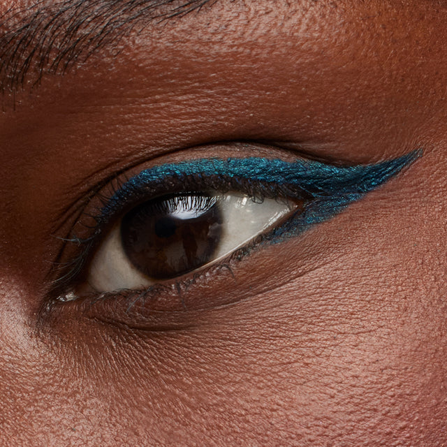 Dark brown eye model wearing Soulgazer in Cosmic