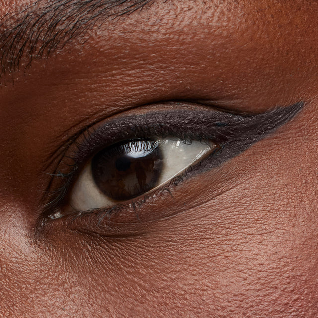 Dark brown eye model wearing Soulgazer in Orbit
