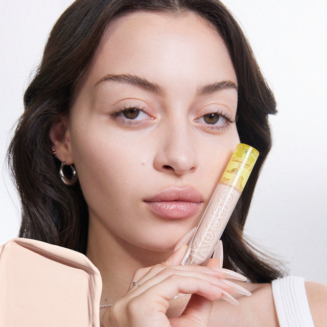 Model wearing Mini Revealer Concealer in Tone 1.5 C