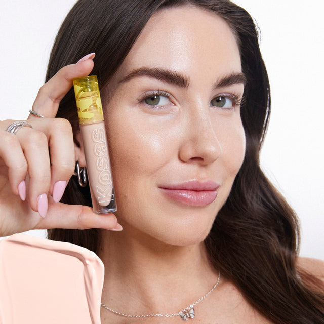 Model wearing Mini Revealer Concealer in Tone 2.6 C