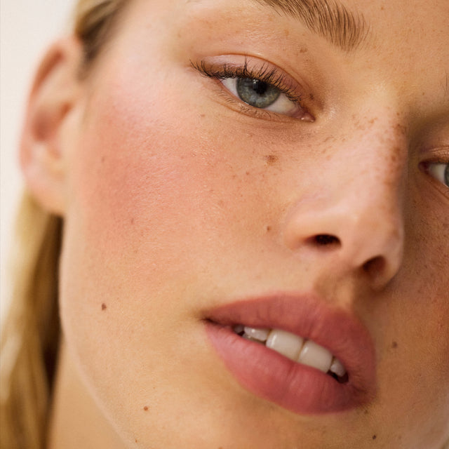Light skin tone model wearing Impressionist Multistick in Intuition