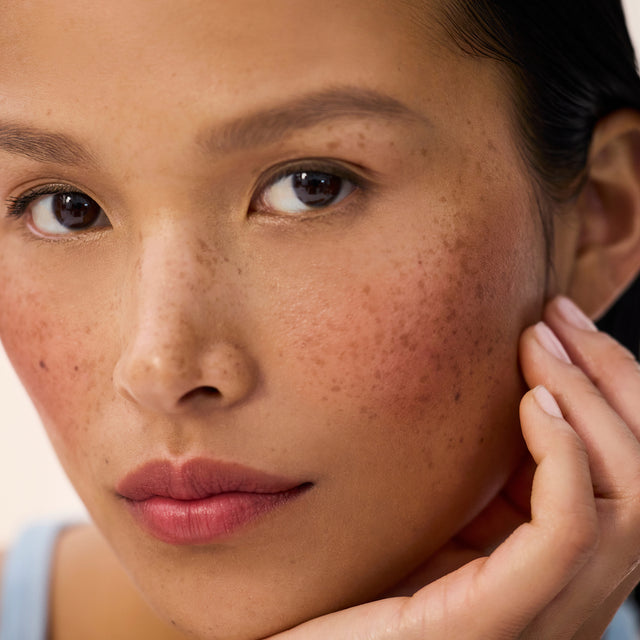 Medium skin tone model wearing Impressionist Multistick in Vibration
