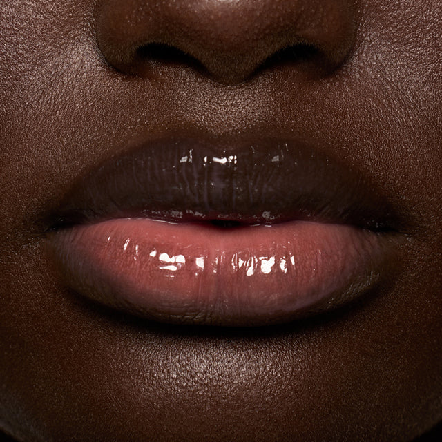 Deep skin tone model wearing Lip Pulse in Aftershock