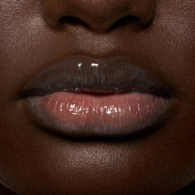 Deep skin tone model wearing Lip Pulse in Love Potion