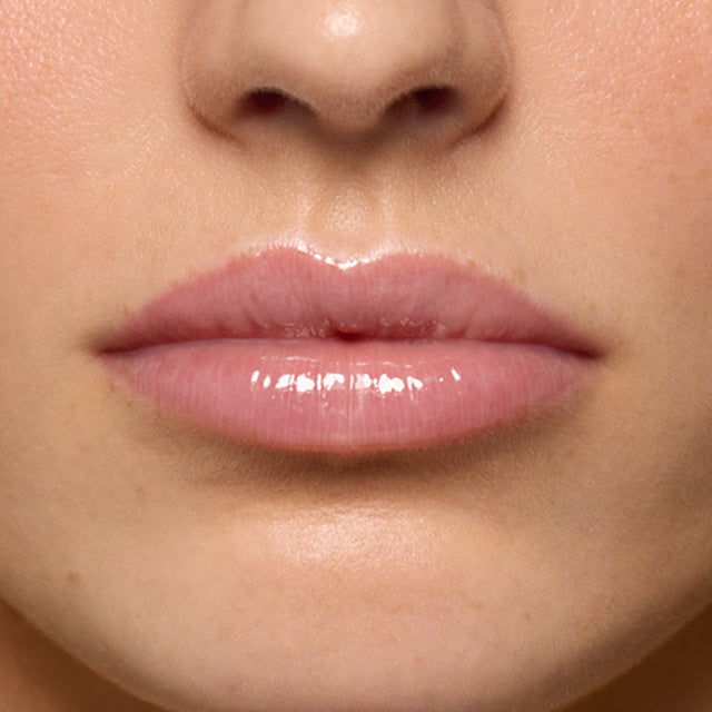 Light skin tone model wearing Lip Pulse in Love Potion