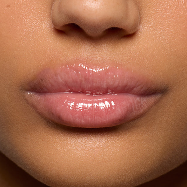 Medium skin tone model wearing Lip Pulse in Love Potion
