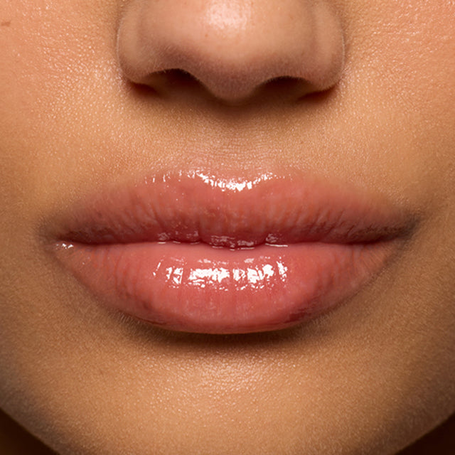 Medium skin tone model wearing Lip Pulse in Sixth Sense
