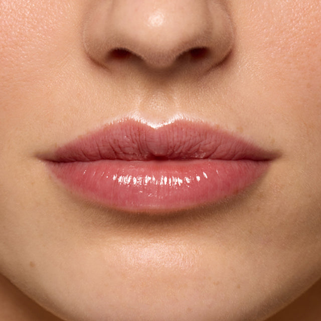 Light skin tone model wearing Lip Pulse in Soulfire