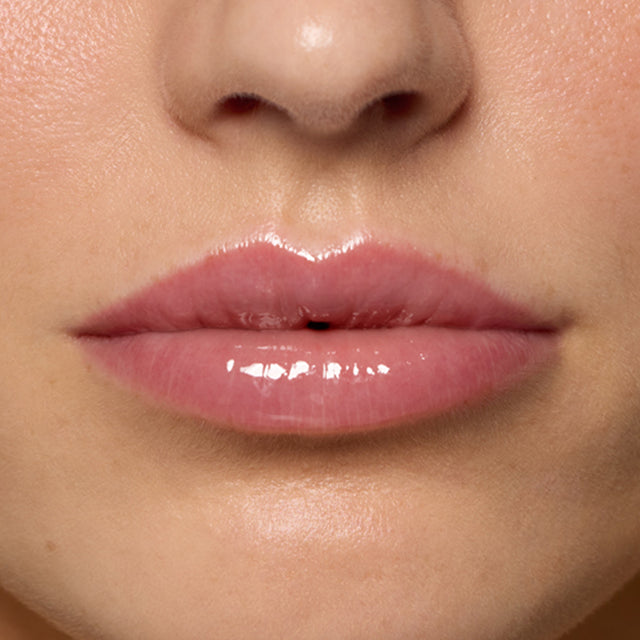 Light skin tone model wearing Lip Pulse in Unspoken