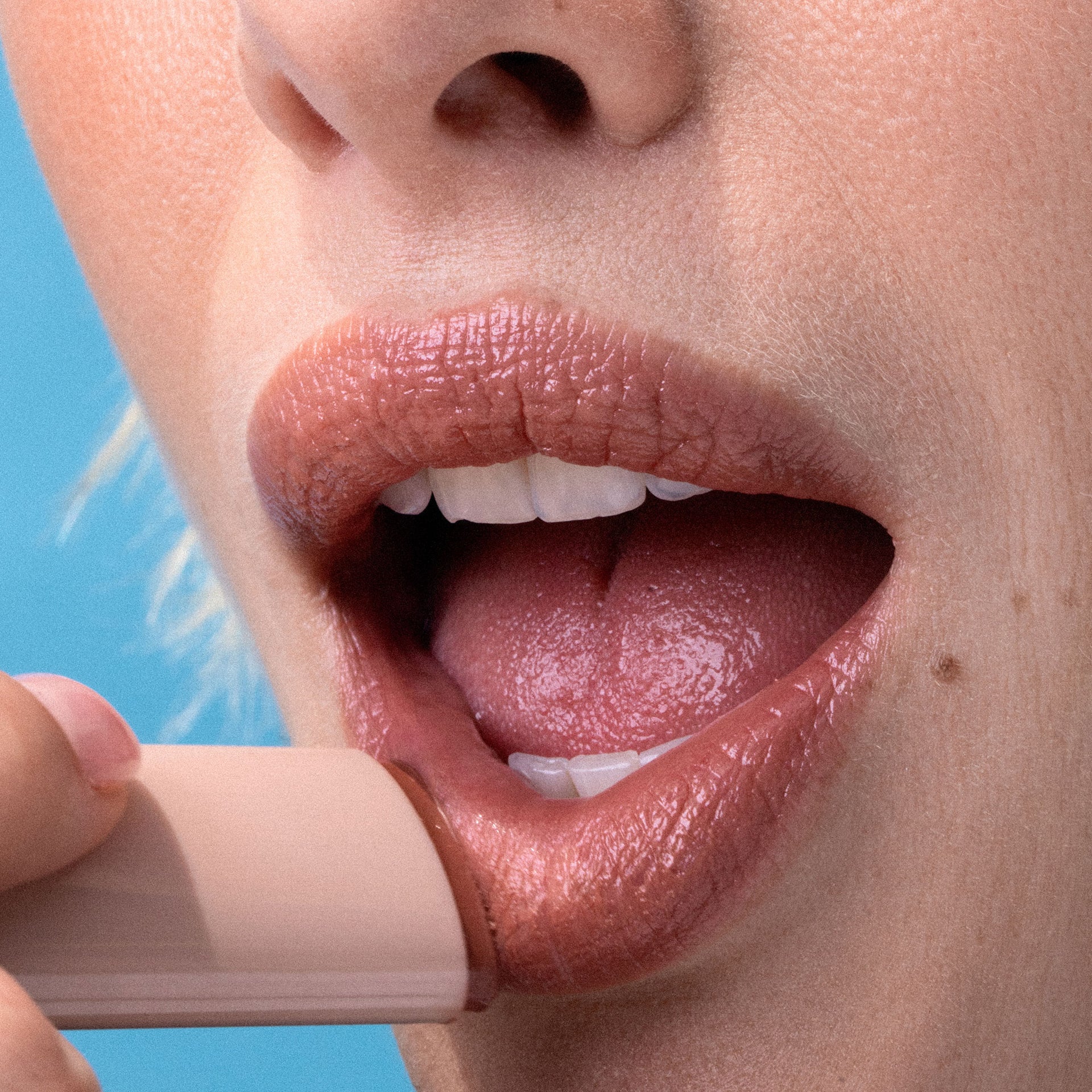 Close up application of LipFuel Lip Balm